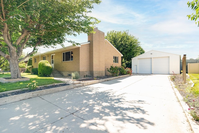 649 W Bulldog Cir, Murray, UT 84123 - view of property exterior featuring a garage, an outdoor structure, brick siding, a chimney, and a lawn