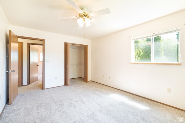 649 W Bulldog Cir, Murray, UT 84123 - unfurnished bedroom with light carpet, baseboards, a closet, and a ceiling fan