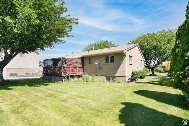 649 W Bulldog Cir, Murray, UT 84123 - rear view of property with a deck, a yard, and brick siding