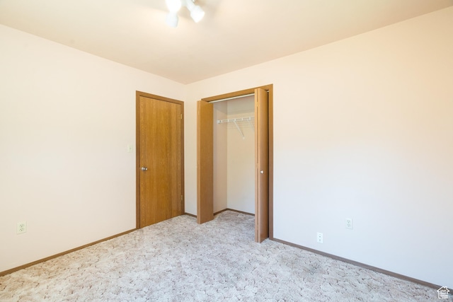 649 W Bulldog Cir, Murray, UT 84123 - unfurnished bedroom featuring light carpet, baseboards, and a closet