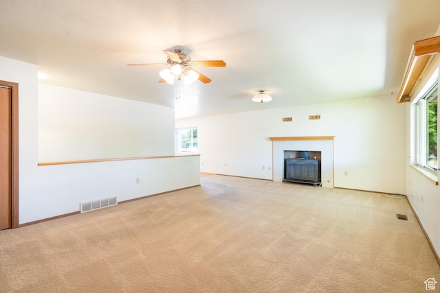 649 W Bulldog Cir, Murray, UT 84123 - unfurnished living room with carpet, a ceiling fan, a fireplace with flush hearth, and baseboards