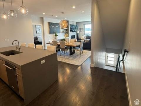 795 E Miner Way, Hideout, UT 84036 - kitchen with a sink, dark wood-style floors, hanging light fixtures, an island with sink, and dishwasher