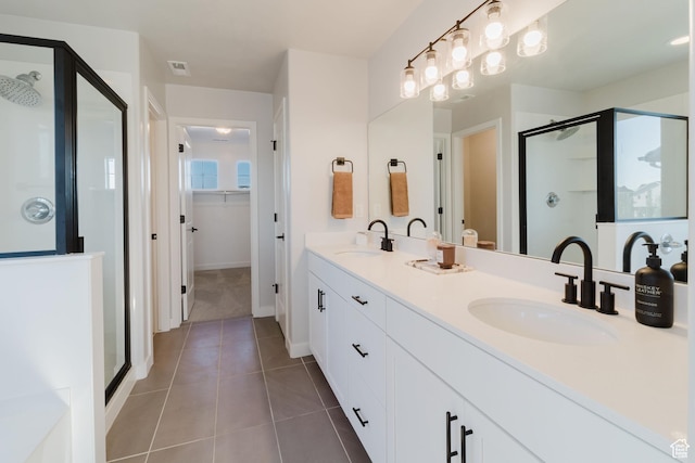 903 S 250 W, American Fork, UT 84003 - bathroom with a stall shower, double vanity, tile patterned floors, and a spacious closet