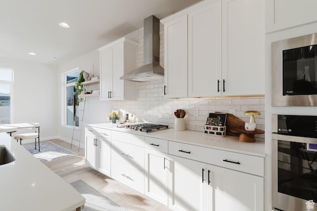 903 S 250 W, American Fork, UT 84003 - kitchen with wall chimney range hood, stainless steel appliances, decorative backsplash, open shelves, and light countertops