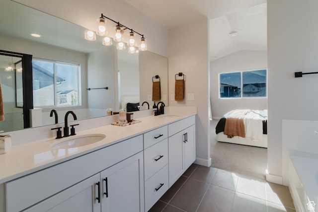 903 S 250 W, American Fork, UT 84003 - ensuite bathroom with double vanity, a tub, tile patterned floors, and vaulted ceiling