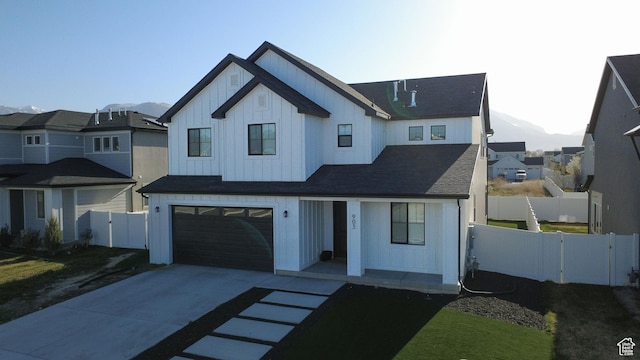 903 S 250 W, American Fork, UT 84003 - modern farmhouse style home featuring board and batten siding, concrete driveway, a garage, a mountain view, and a residential view