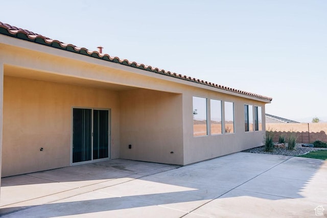 579 N Staci Dr, Hurricane, UT 84737 - rear view of house featuring a patio area, a tiled roof, and stucco siding