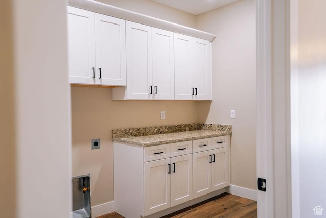 579 N Staci Dr, Hurricane, UT 84737 - laundry area featuring cabinet space, wood finished floors, and hookup for an electric dryer