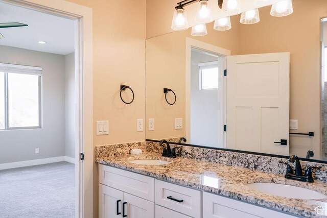 579 N Staci Dr, Hurricane, UT 84737 - bathroom featuring double vanity and baseboards