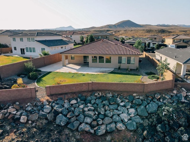 579 N Staci Dr, Hurricane, UT 84737 - back of property featuring a fenced backyard, a mountain view, a patio area, and a gate