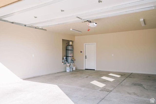 579 N Staci Dr, Hurricane, UT 84737 - garage with strapped water heater and a garage door opener