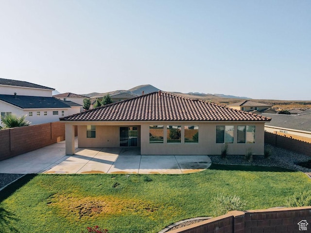 579 N Staci Dr, Hurricane, UT 84737 - back of property featuring stucco siding, a tile roof, and a fenced backyard
