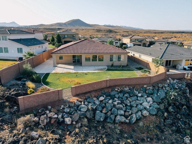 579 N Staci Dr, Hurricane, UT 84737 - rear view of house with a patio, a mountain view, and a fenced backyard