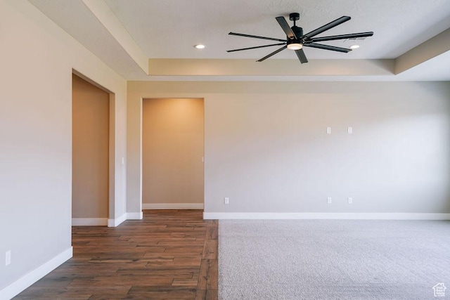 579 N Staci Dr, Hurricane, UT 84737 - spare room featuring a ceiling fan, dark wood finished floors, recessed lighting, and a raised ceiling