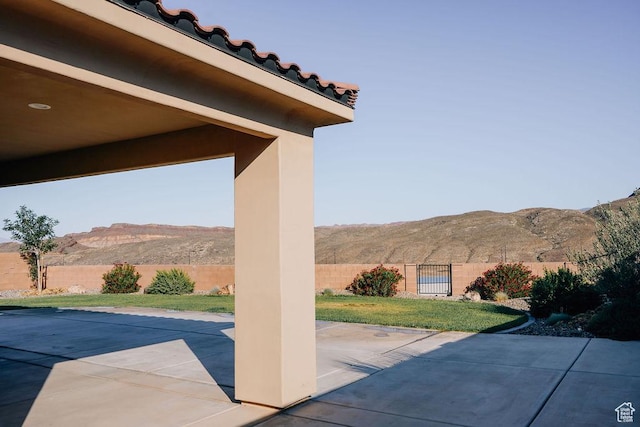579 N Staci Dr, Hurricane, UT 84737 - fenced backyard with a mountain view and a patio area