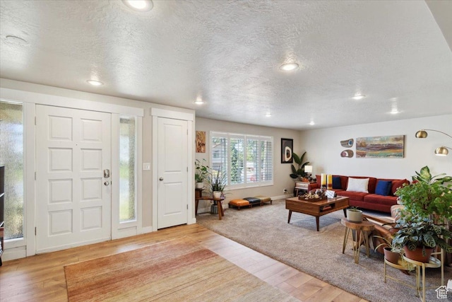 846 E 5600 S, South Ogden, UT 84405 - living area featuring light wood finished floors, a textured ceiling, and recessed lighting