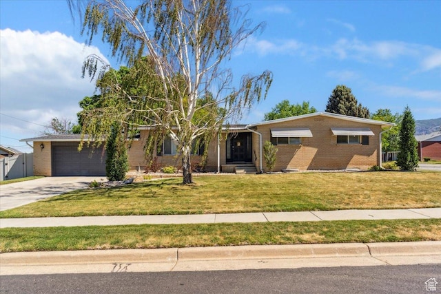 846 E 5600 S, South Ogden, UT 84405 - ranch-style home with brick siding, concrete driveway, a front lawn, and a garage