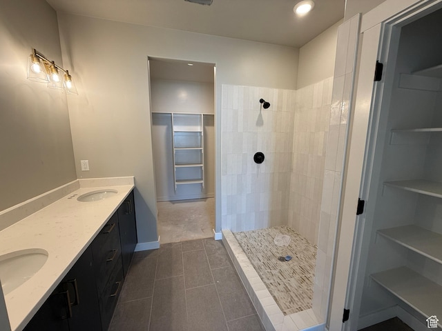 28 S 3830 W Unit 424, West Point, UT 84015 - full bath featuring a tile shower, double vanity, tile patterned floors, recessed lighting, and a walk in closet
