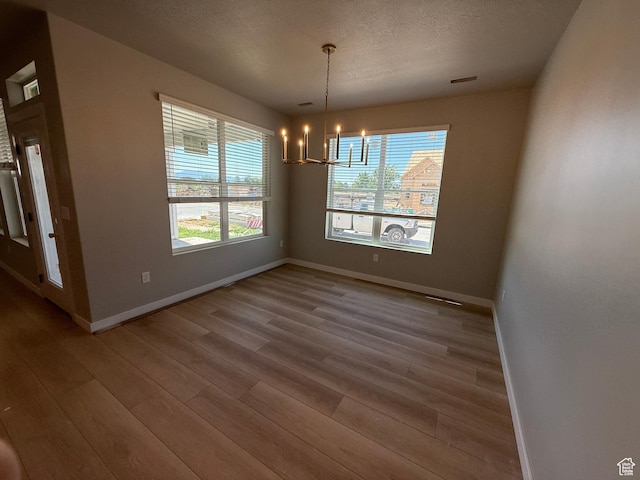 28 S 3830 W Unit 424, West Point, UT 84015 - unfurnished dining area with wood finished floors and a chandelier