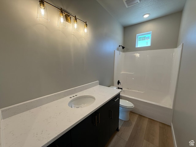 28 S 3830 W Unit 424, West Point, UT 84015 - bathroom featuring wood finished floors, vanity, and bathtub / shower combination