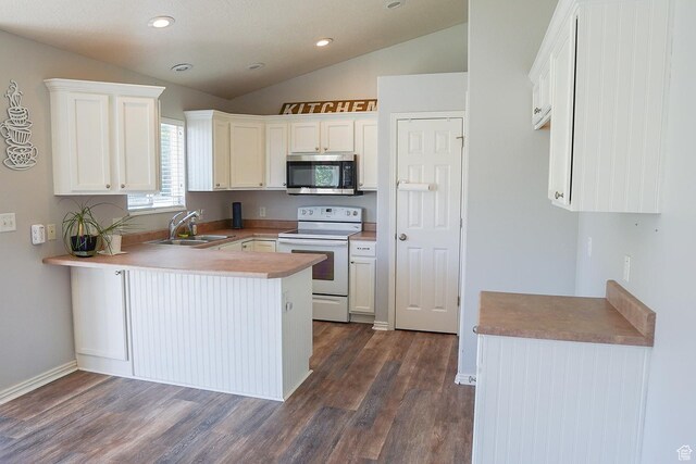 197 W 1750 N, Lehi, UT 84043 - kitchen with white electric range, stainless steel microwave, vaulted ceiling, a peninsula, and dark wood finished floors