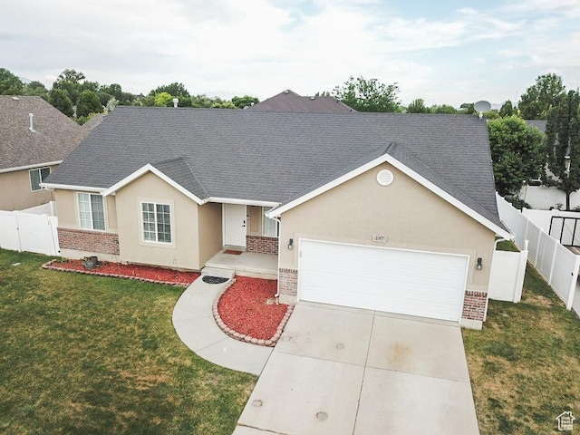 197 W 1750 N, Lehi, UT 84043 - view of front of house with stucco siding, brick siding, an attached garage, a shingled roof, and driveway