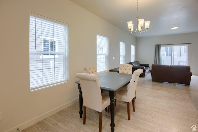 1677 S Haven Pkwy, West Haven, UT 84401 - dining room with a chandelier and light wood finished floors