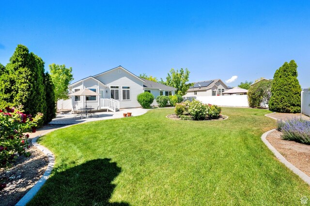 7443 W Perennial Dr, Magna, UT 84044 - view of yard featuring a patio area
