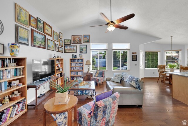 7443 W Perennial Dr, Magna, UT 84044 - living room featuring ceiling fan, lofted ceiling, healthy amount of natural light, wood finished floors, and a chandelier