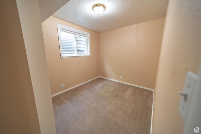 617 Aspen Cir, Price, UT 84501 - carpeted empty room featuring a textured ceiling and baseboards