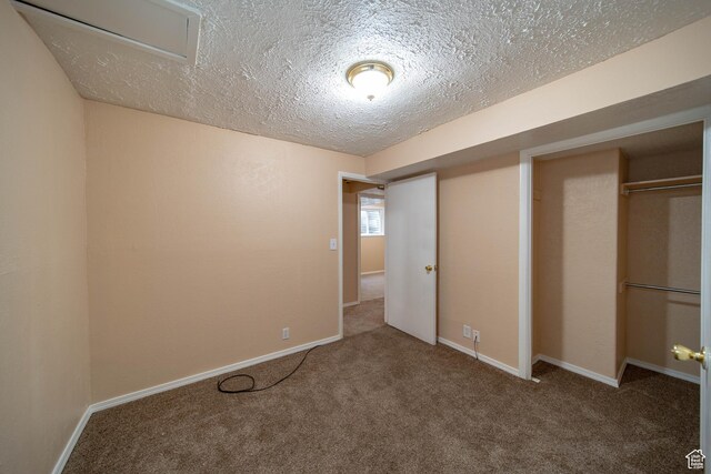617 Aspen Cir, Price, UT 84501 - unfurnished bedroom featuring a textured ceiling, carpet, and a closet