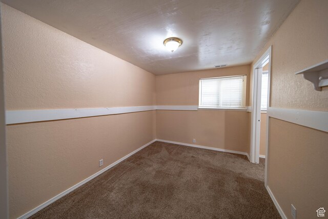 617 Aspen Cir, Price, UT 84501 - carpeted spare room featuring a textured wall and baseboards