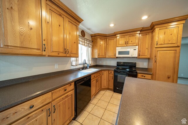 617 Aspen Cir, Price, UT 84501 - kitchen with black appliances, dark countertops, light tile patterned flooring, recessed lighting, and brown cabinetry