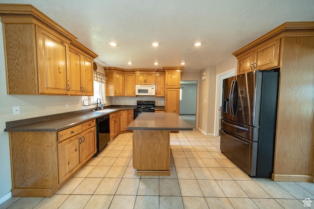 617 Aspen Cir, Price, UT 84501 - kitchen featuring black appliances, dark countertops, a center island, recessed lighting, and light tile patterned flooring