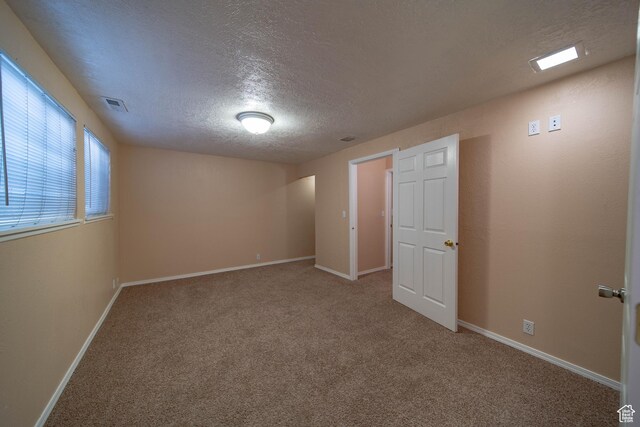 617 Aspen Cir, Price, UT 84501 - unfurnished bedroom featuring a textured ceiling and carpet floors