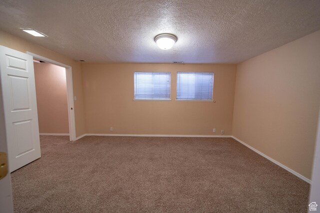 617 Aspen Cir, Price, UT 84501 - carpeted spare room featuring a textured ceiling and baseboards