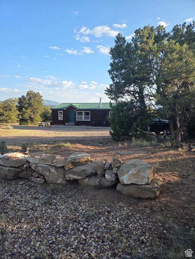 6430 S 37280 W Unit 40, Fruitland, UT 84027 - view of front of house featuring a metal roof and an outdoor fire pit
