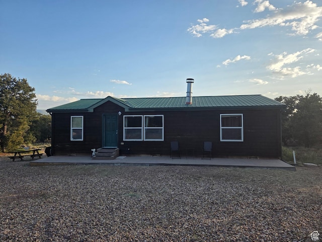 6430 S 37280 W Unit 40, Fruitland, UT 84027 - view of front of home with a metal roof and a patio area