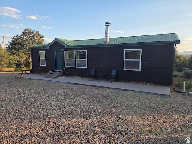 6430 S 37280 W Unit 40, Fruitland, UT 84027 - rear view of house featuring a metal roof and a patio area