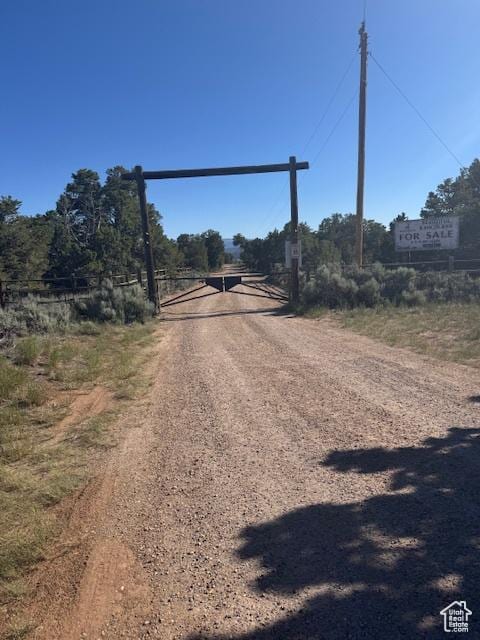 6430 S 37280 W Unit 40, Fruitland, UT 84027 - view of dirt / gravel driveway featuring a gated entry