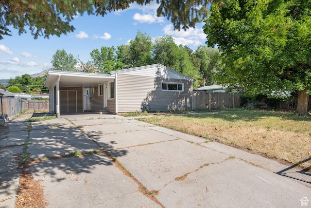 1866 E Village Rd S, Salt Lake City, UT 84121 - view of front of property with driveway and an attached carport