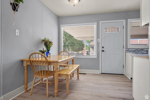 1866 E Village Rd S, Salt Lake City, UT 84121 - dining space with light wood finished floors and baseboards