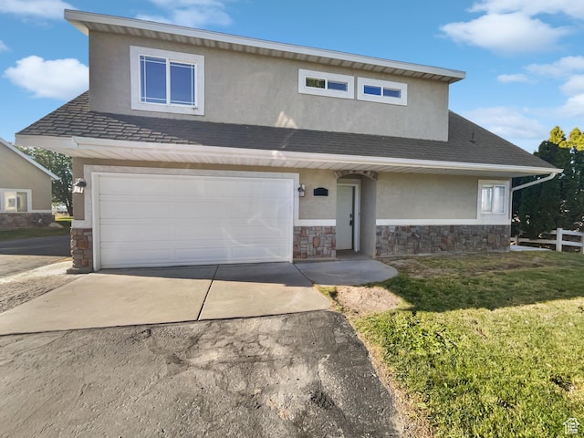 2238 N Harvest Moon Dr, Saratoga Springs, UT 84045 - view of front of property with stone siding, concrete driveway, stucco siding, and an attached garage