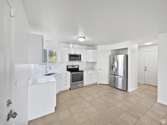 2238 N Harvest Moon Dr, Saratoga Springs, UT 84045 - kitchen with stainless steel appliances, light tile patterned floors, light countertops, and white cabinets