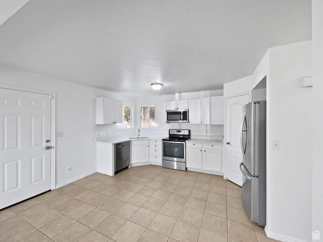 2238 N Harvest Moon Dr, Saratoga Springs, UT 84045 - kitchen with appliances with stainless steel finishes, light tile patterned floors, light countertops, and white cabinetry