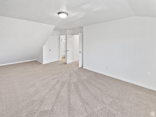 2238 N Harvest Moon Dr, Saratoga Springs, UT 84045 - additional living space featuring lofted ceiling and carpet floors