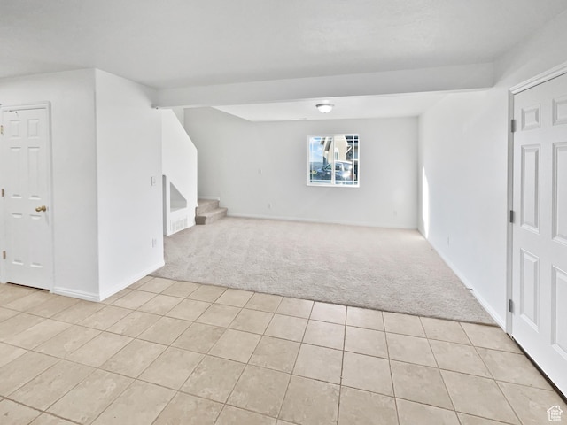 2238 N Harvest Moon Dr, Saratoga Springs, UT 84045 - unfurnished room featuring light carpet, light tile patterned flooring, and stairs