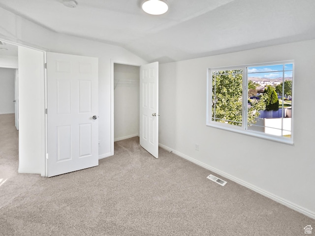 2238 N Harvest Moon Dr, Saratoga Springs, UT 84045 - unfurnished bedroom with carpet floors, lofted ceiling, and a closet