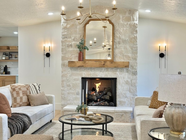 5862 S Ayrshire Dr, Murray, UT 84107 - living area featuring a chandelier, a textured ceiling, a fireplace, and wood finished floors