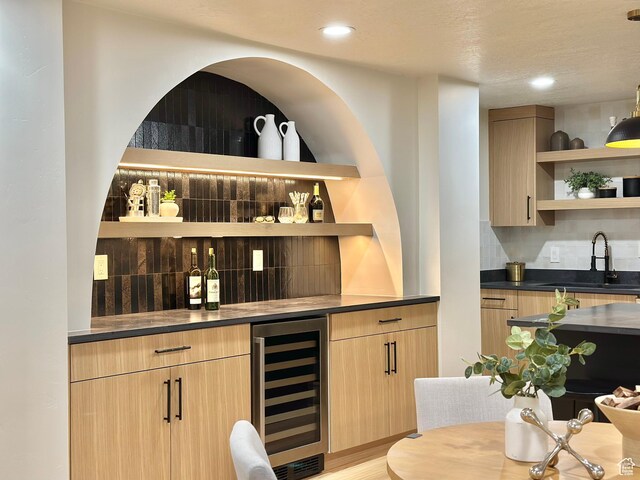 5862 S Ayrshire Dr, Murray, UT 84107 - indoor wet bar with beverage cooler, backsplash, recessed lighting, and light wood-type flooring